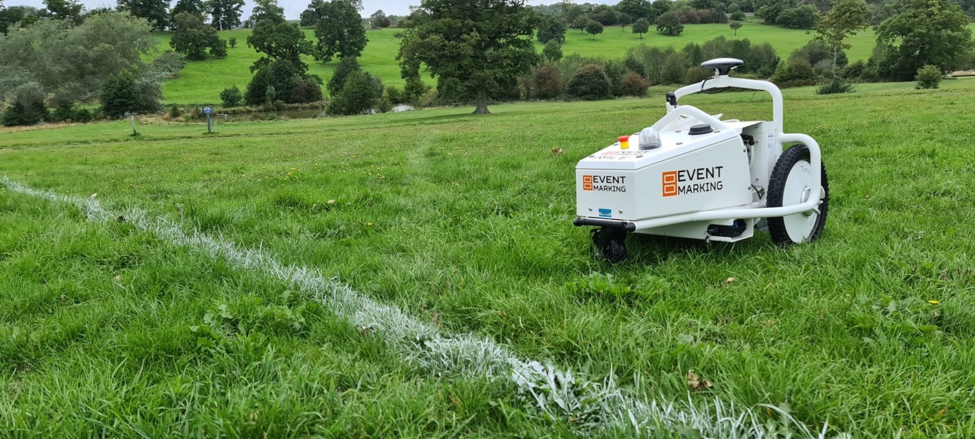 GPS line marking robot painting on green grass